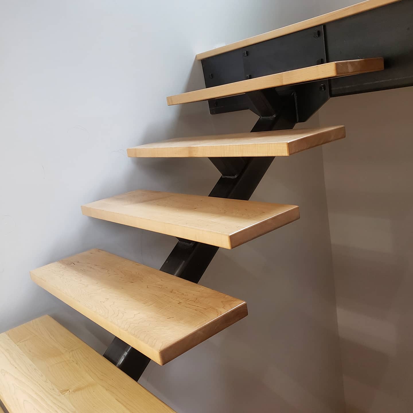 Modern wooden staircase with metal structure
