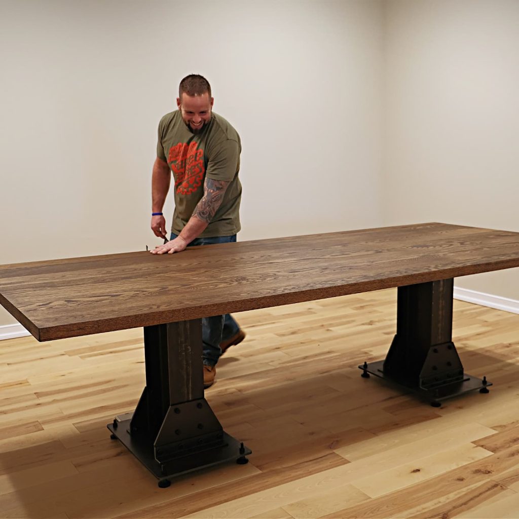 man working on wood table